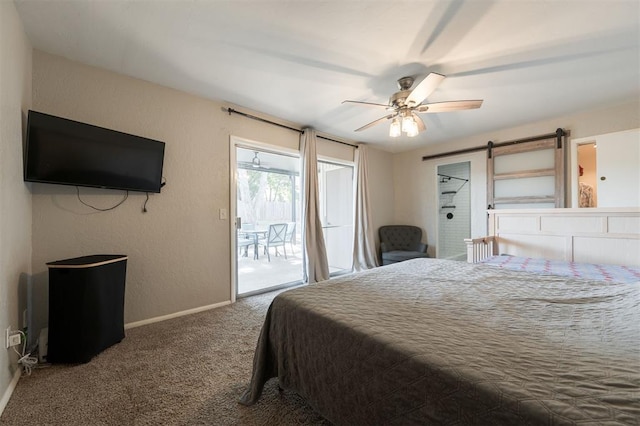 bedroom with access to exterior, a barn door, ceiling fan, and carpet flooring