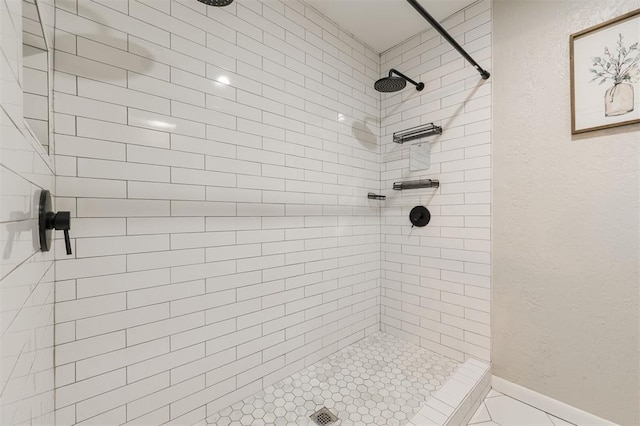 bathroom with a tile shower