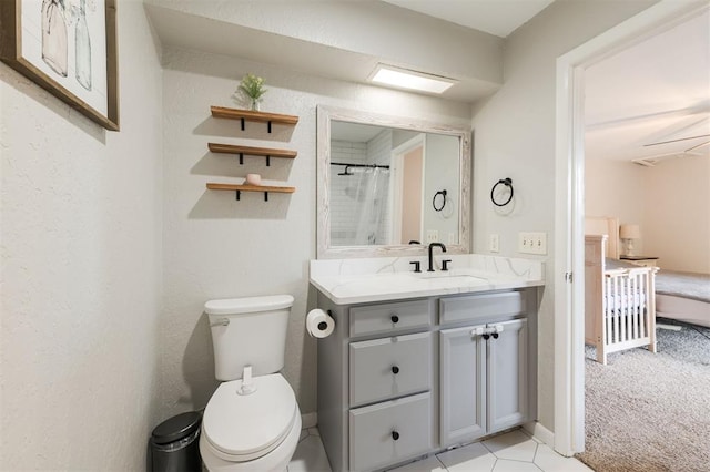 bathroom with a shower with curtain, vanity, and toilet