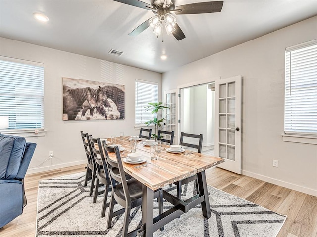 dining space featuring ceiling fan, plenty of natural light, and light hardwood / wood-style floors