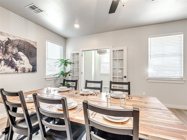 dining area featuring hardwood / wood-style floors and ceiling fan