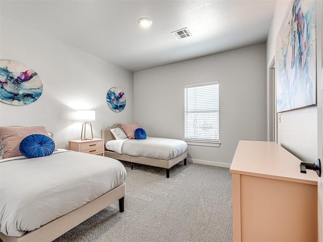 bedroom featuring light colored carpet