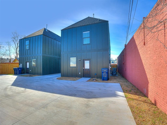 back of property with central air condition unit