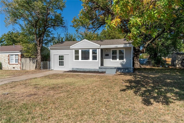 single story home with a front yard