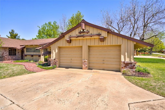 view of front of property with a garage and a front lawn