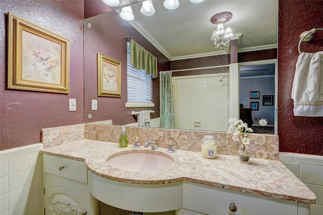 bathroom with crown molding, tile walls, vanity, and curtained shower