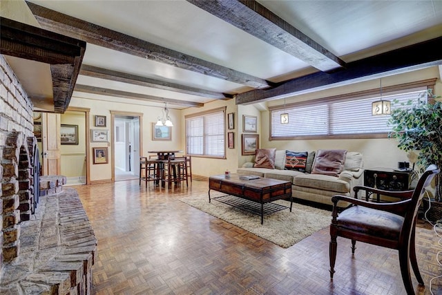 living room featuring parquet flooring and beamed ceiling