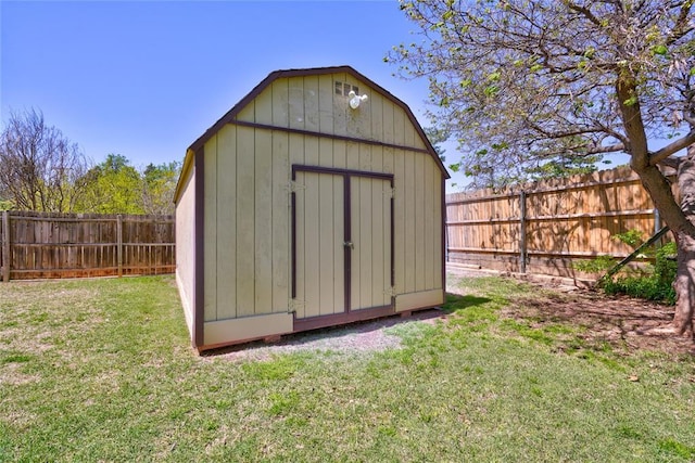 view of outbuilding with a lawn