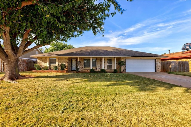 single story home with brick siding, concrete driveway, an attached garage, fence, and a front lawn