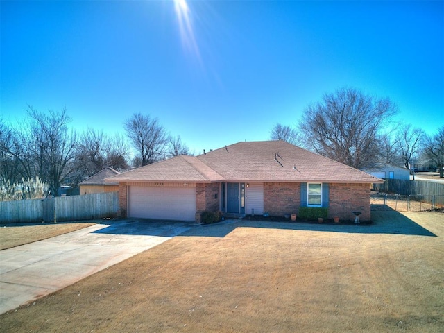 ranch-style house with a garage and a front yard