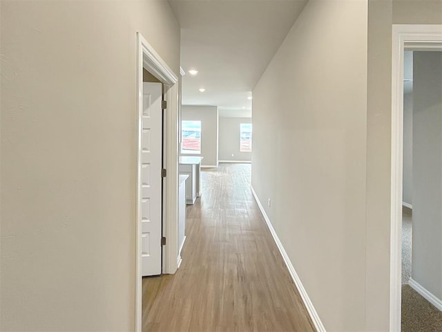 hall with light hardwood / wood-style floors