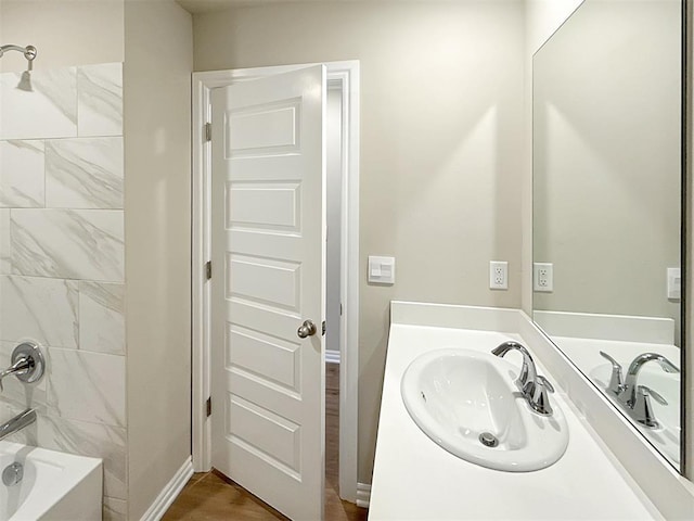 bathroom featuring vanity and shower / bathtub combination