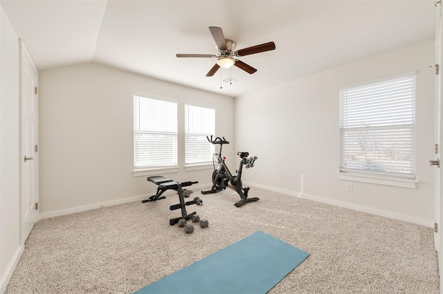 exercise area with vaulted ceiling, carpet, and ceiling fan