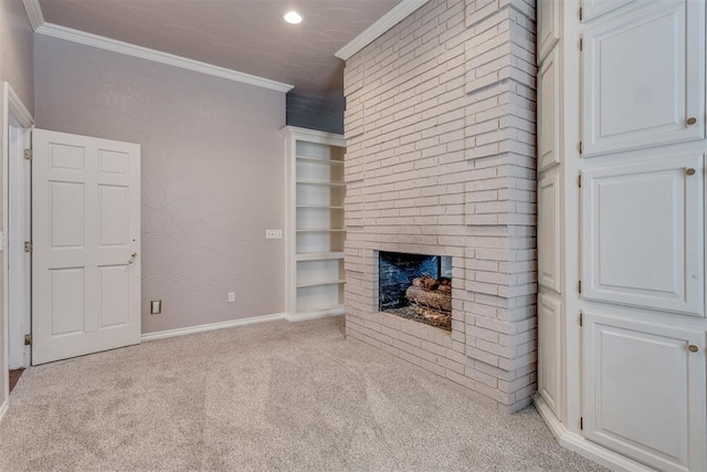 unfurnished living room with ornamental molding, light colored carpet, a fireplace, and built in shelves