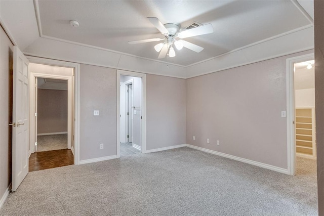 unfurnished bedroom featuring light colored carpet and ceiling fan