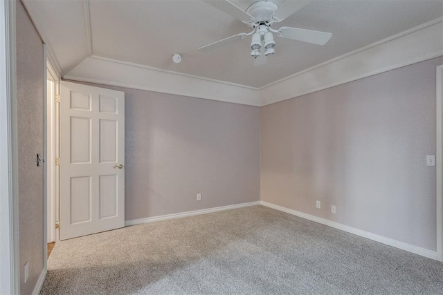 spare room featuring crown molding, light carpet, and ceiling fan