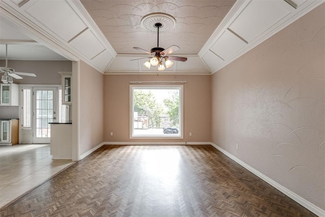 spare room featuring ornamental molding, lofted ceiling, parquet floors, and ceiling fan