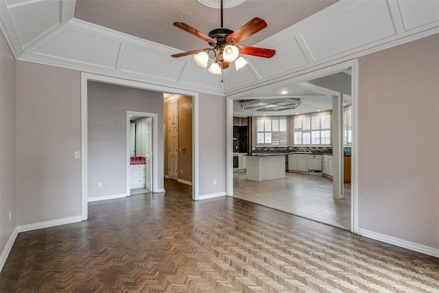 unfurnished living room with parquet floors and ceiling fan