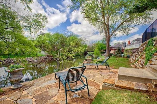 view of patio / terrace featuring a water view