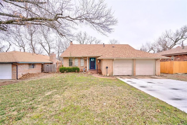 ranch-style home with brick siding, a front lawn, fence, concrete driveway, and a garage