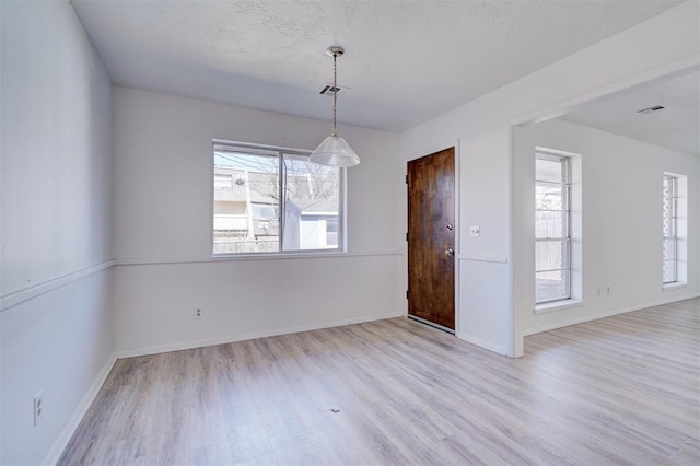 unfurnished room with light hardwood / wood-style flooring