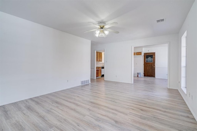 unfurnished room with ceiling fan and light wood-type flooring