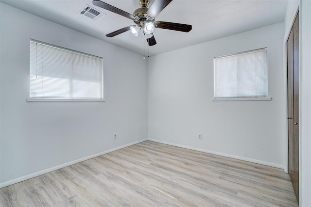 unfurnished room with ceiling fan and light wood-type flooring