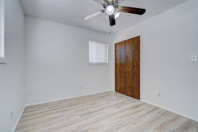 unfurnished room with ceiling fan and light hardwood / wood-style flooring