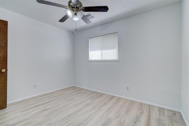 spare room featuring ceiling fan and light hardwood / wood-style flooring