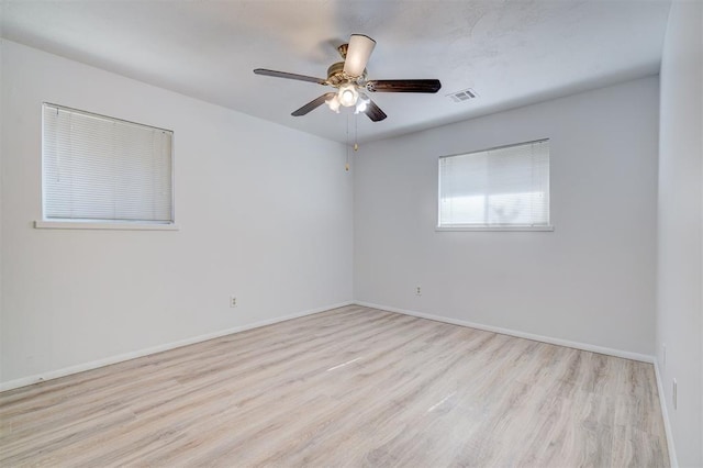 spare room featuring ceiling fan and light hardwood / wood-style floors