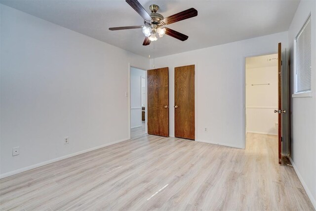 unfurnished bedroom featuring light hardwood / wood-style flooring, a closet, and ceiling fan