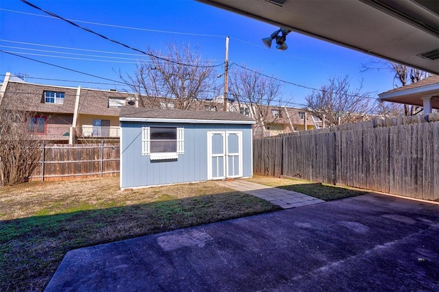 view of yard with a shed and a patio