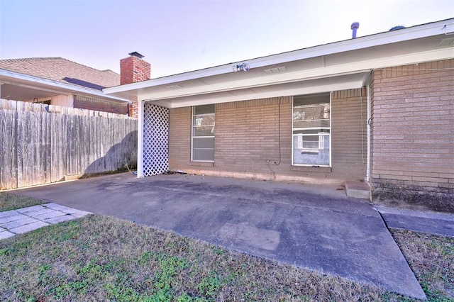 rear view of property featuring a patio area