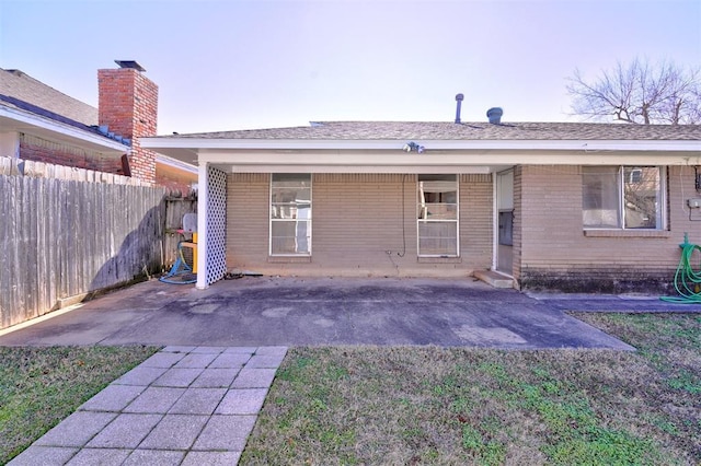 rear view of property featuring a patio