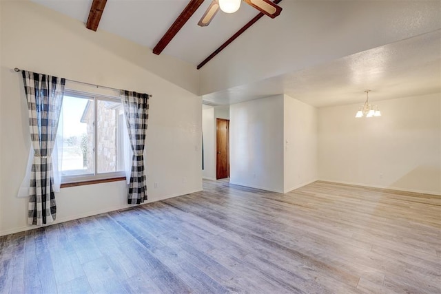 unfurnished room with beamed ceiling, high vaulted ceiling, ceiling fan with notable chandelier, and light hardwood / wood-style floors