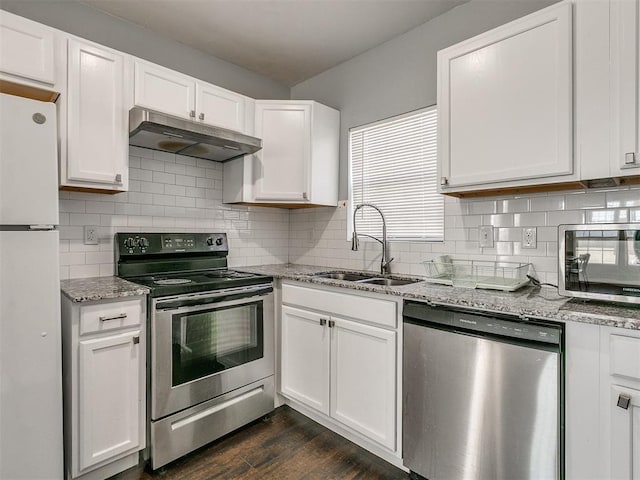 kitchen with stainless steel appliances, sink, and white cabinets