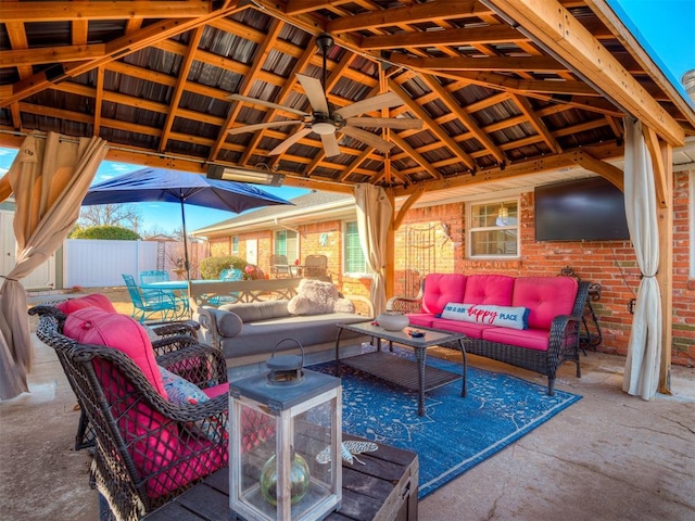 view of patio / terrace with a gazebo, outdoor lounge area, and ceiling fan