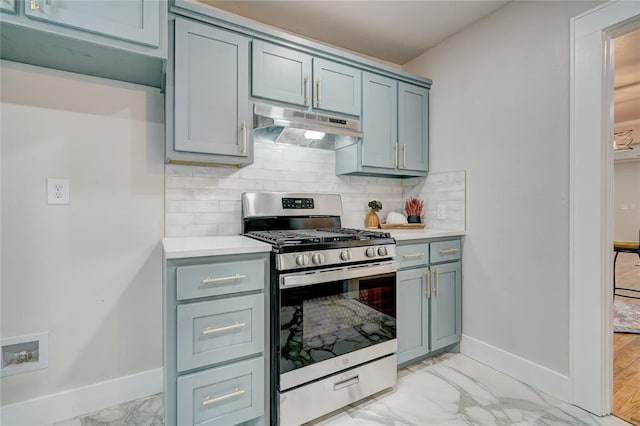 kitchen featuring tasteful backsplash and gas stove