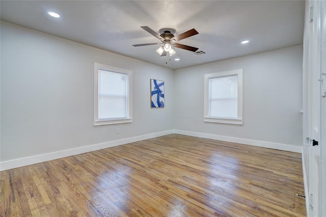 empty room featuring light hardwood / wood-style flooring and ceiling fan