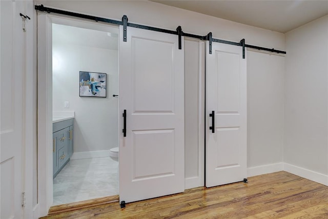 bathroom featuring vanity, toilet, and wood-type flooring