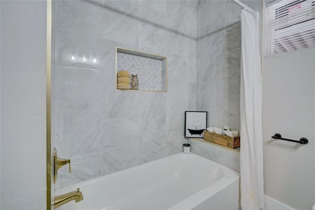 bathroom featuring shower / bathtub combination with curtain