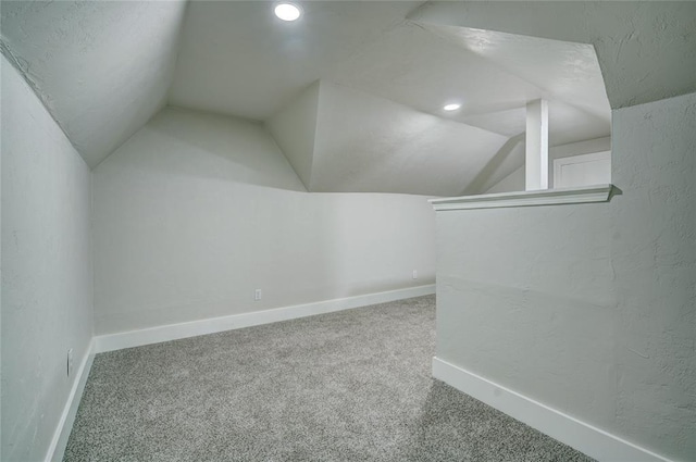 bonus room with carpet and lofted ceiling