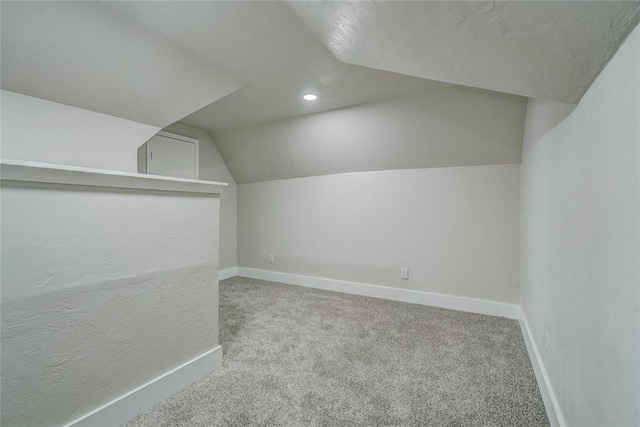 bonus room featuring carpet and lofted ceiling