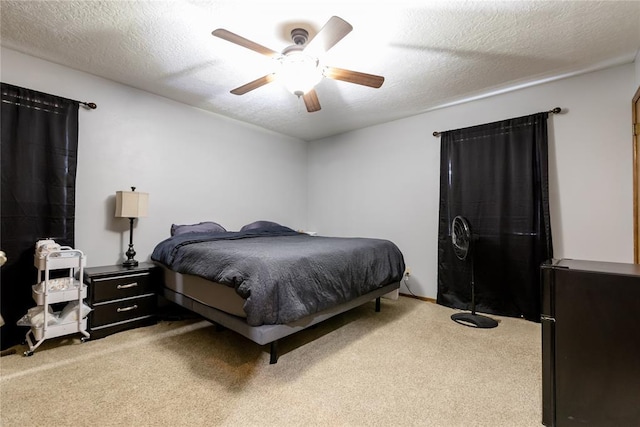 bedroom featuring carpet flooring and a textured ceiling