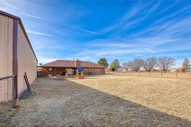 view of yard featuring a rural view and a patio area