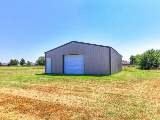 garage featuring a yard