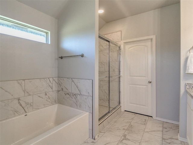 bathroom featuring independent shower and bath