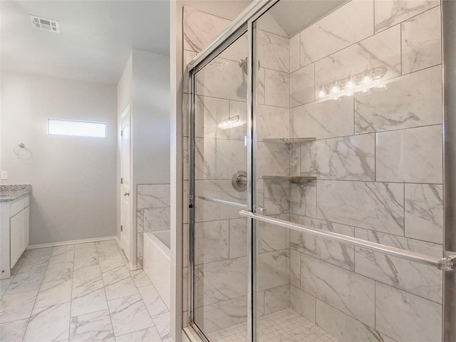 bathroom with vanity and independent shower and bath