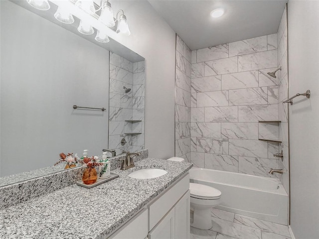 full bathroom with vanity, tiled shower / bath combo, and toilet