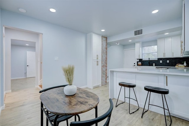 dining space featuring light hardwood / wood-style floors